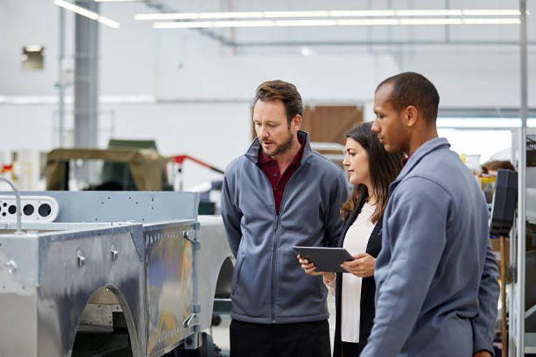 Workers inspecting a machine